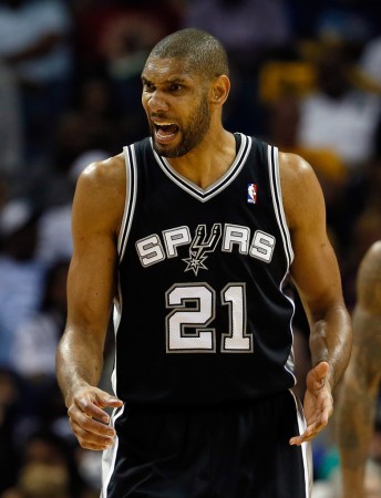 Go ahead and picture Tim Duncan. Probably looks a lot like this picture. Not with the ball, not smiling, just competing.